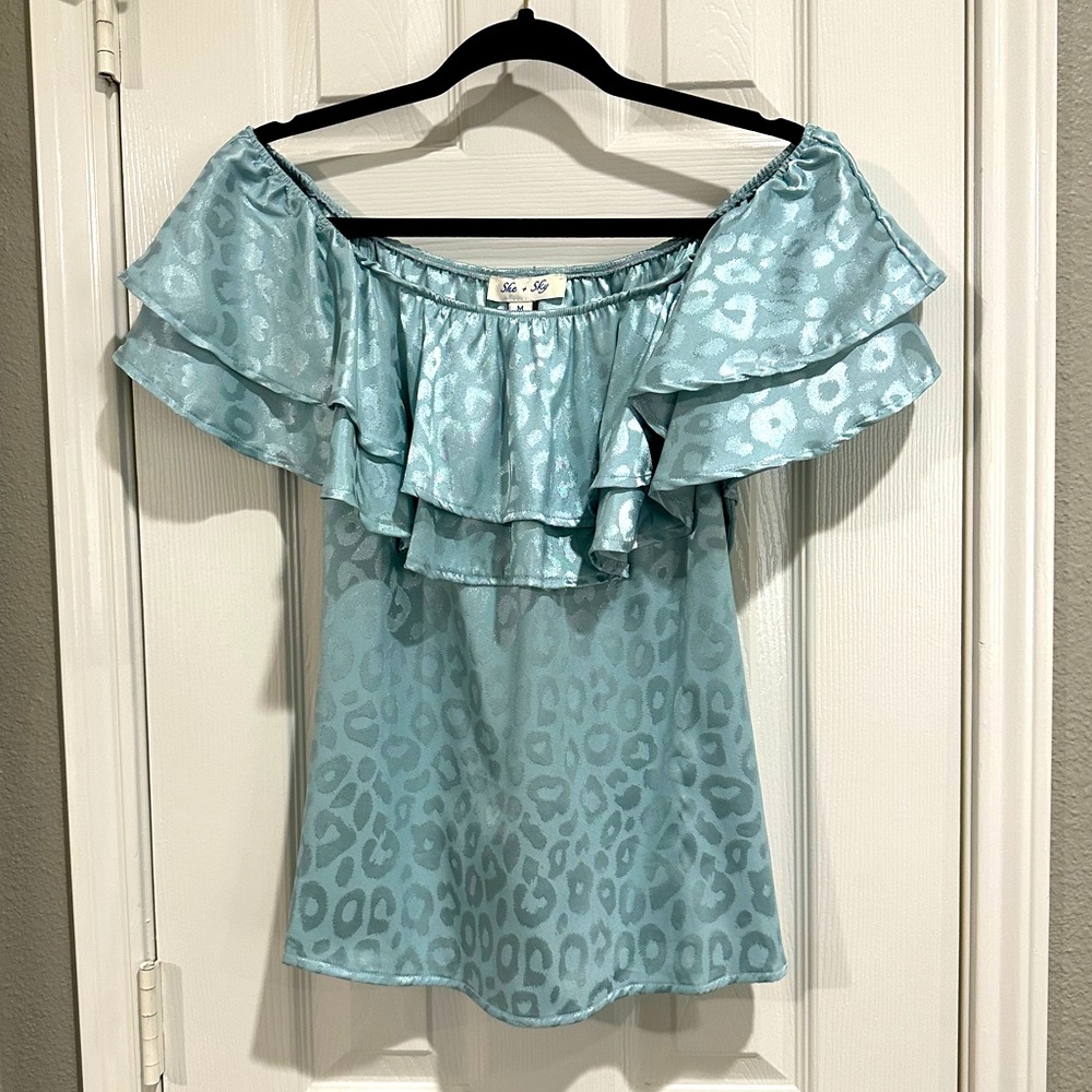 She + Sky over the shoulder with ruffles blouse.